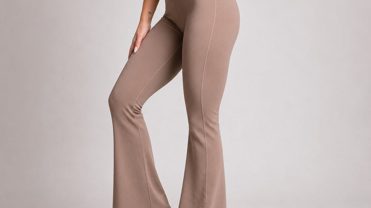 Stylish woman wearing flare leggings for women in a neutral color, paired with white sneakers.