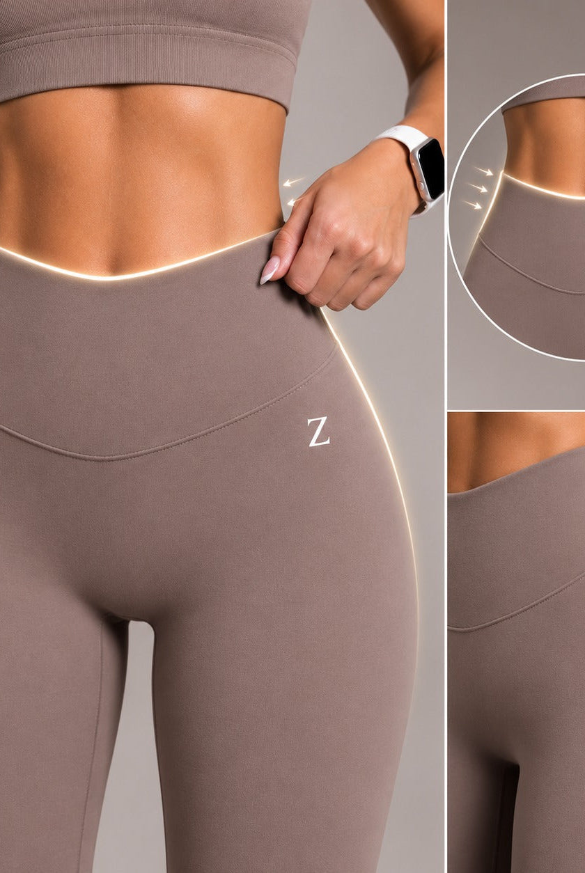 Woman wearing high waist ZANOS yoga tights during a controlled yoga pose