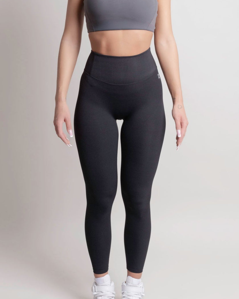 Woman wearing NOIR sport top and leggings front view by ZANOS Apparel