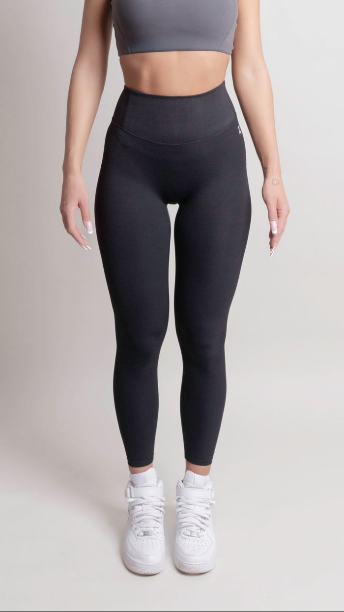Woman wearing NOIR sport top and leggings front view by ZANOS Apparel