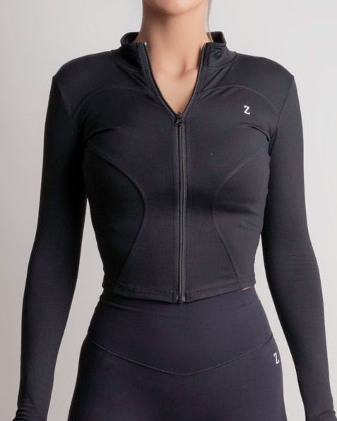 NOIR zip jacket black for Women, lightweight performance layer with a sculpted silhouette, ideal for training and everyday wear.