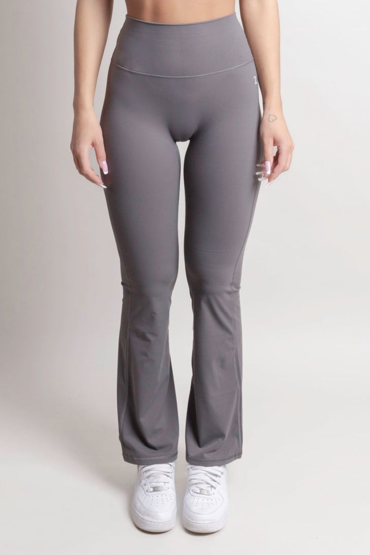 NOIR Flare Pants Grey Women showcasing a flattering high-waisted design with a flared leg silhouette.