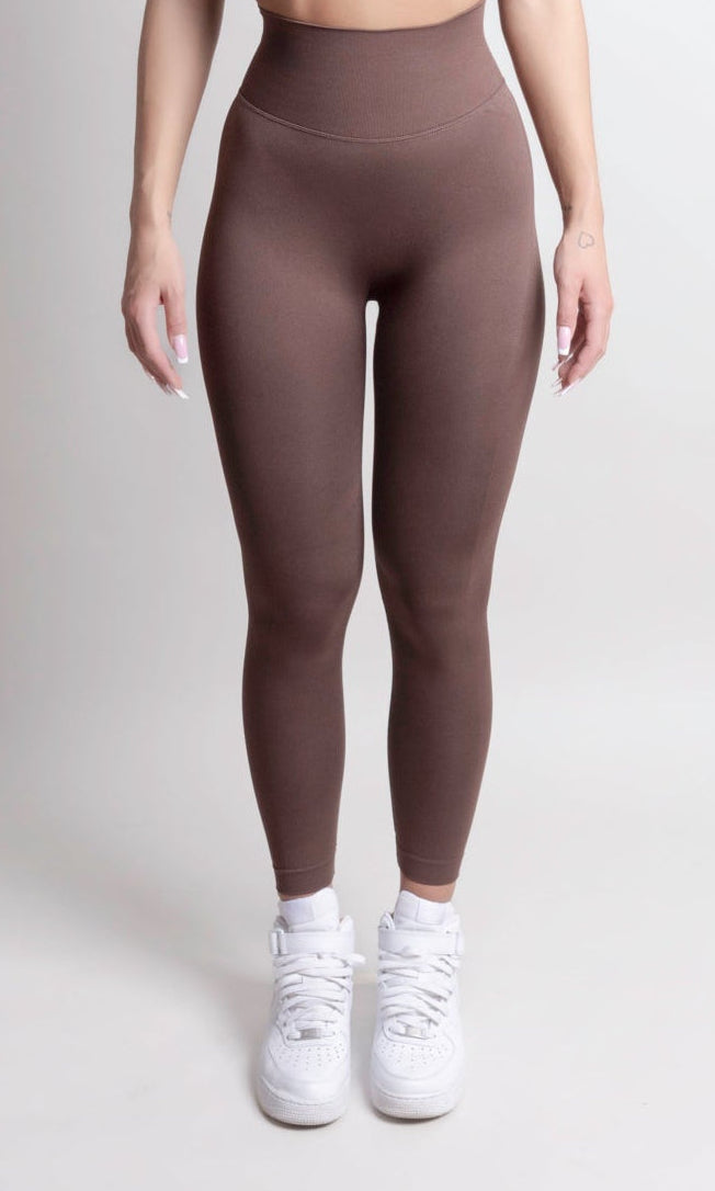 Women wearing NOIR Scrunch Leggings Mocha Brown, showcasing a flattering body-hugging fit and scrunch detail, paired with white sneakers.