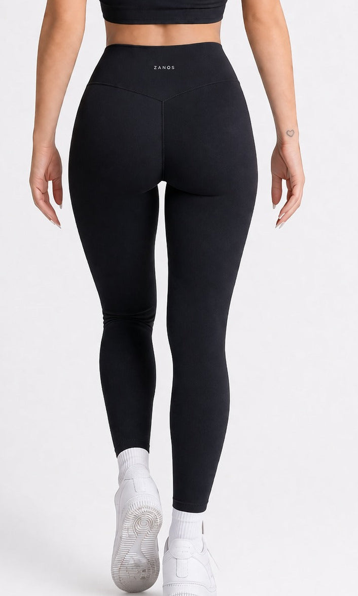 Woman wearing NOIR Yoga Leggings in Black color with matching top, Front showcasing a flattering silhouette and stylish look.