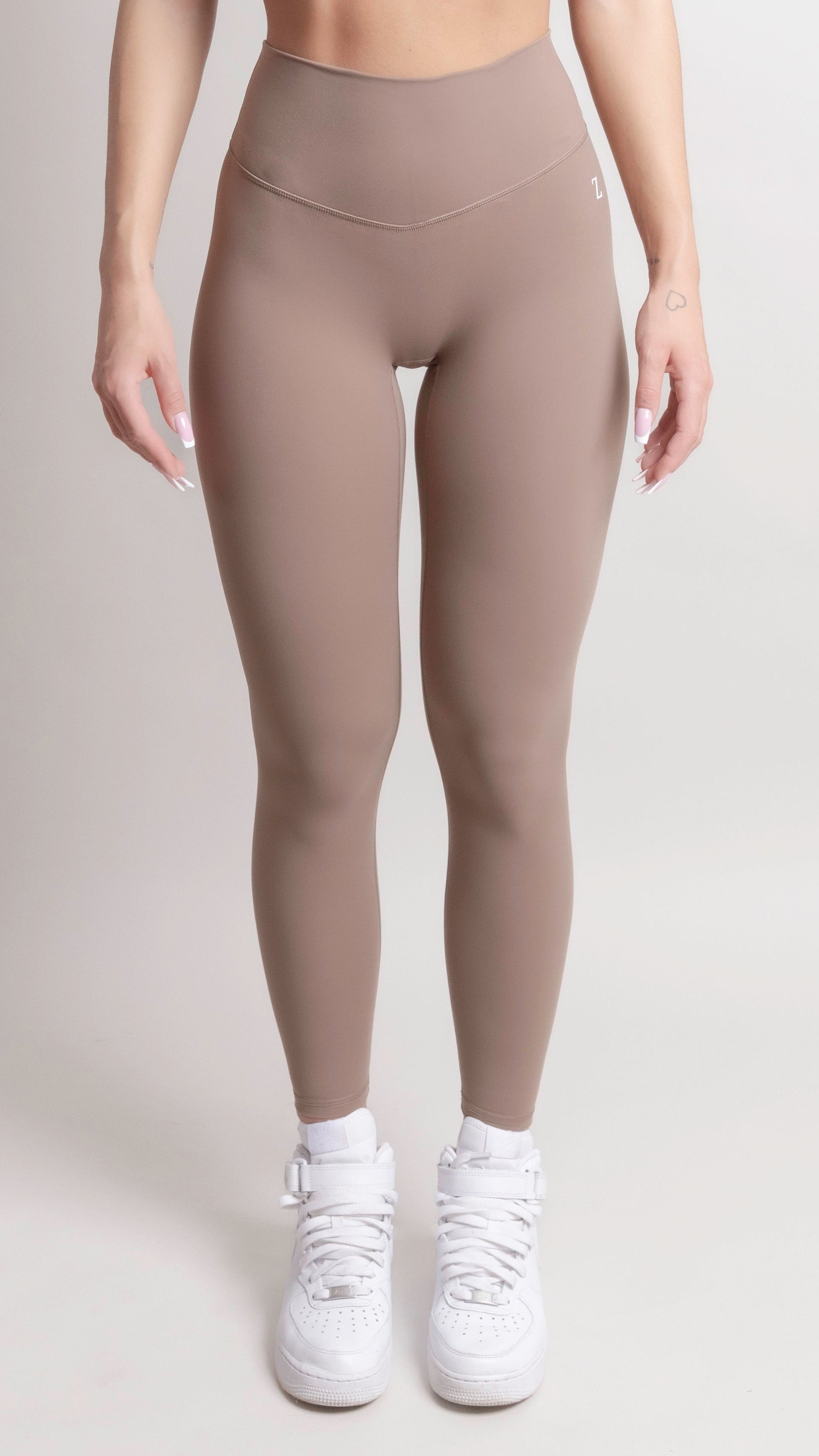 NOIR Yoga Leggings Brown Women showcasing a supportive and sculpting fit, perfect for comfort during workouts.
