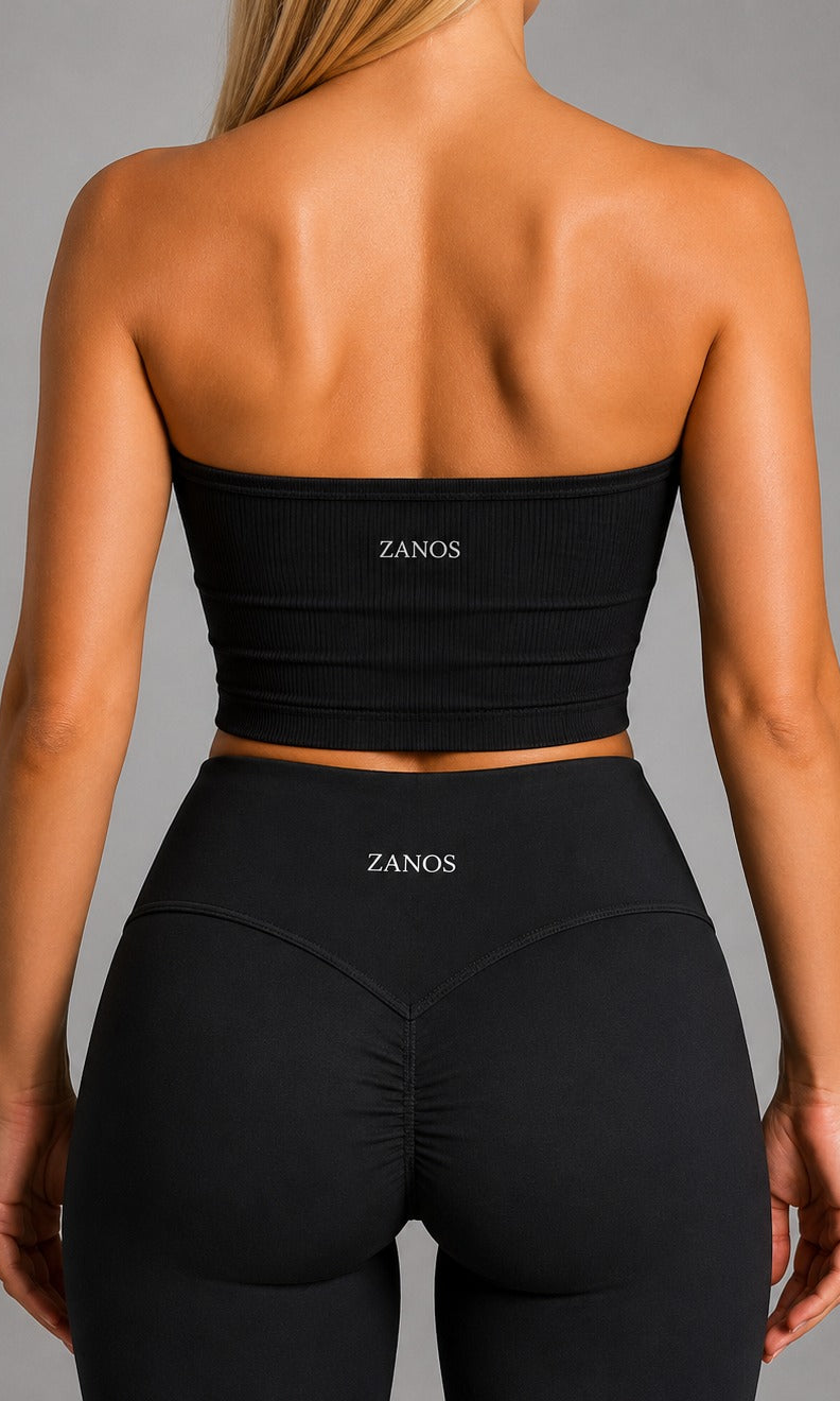 Woman wearing NOIR Bandeau Top in Black, front view.