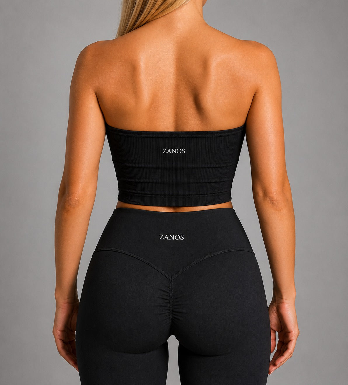 Woman wearing NOIR Bandeau Top in Black, front view.