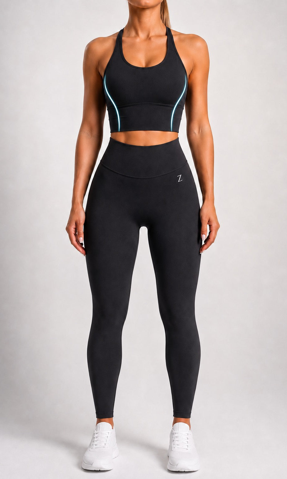 Woman wearing NOIR Cross Top in Black, front view.