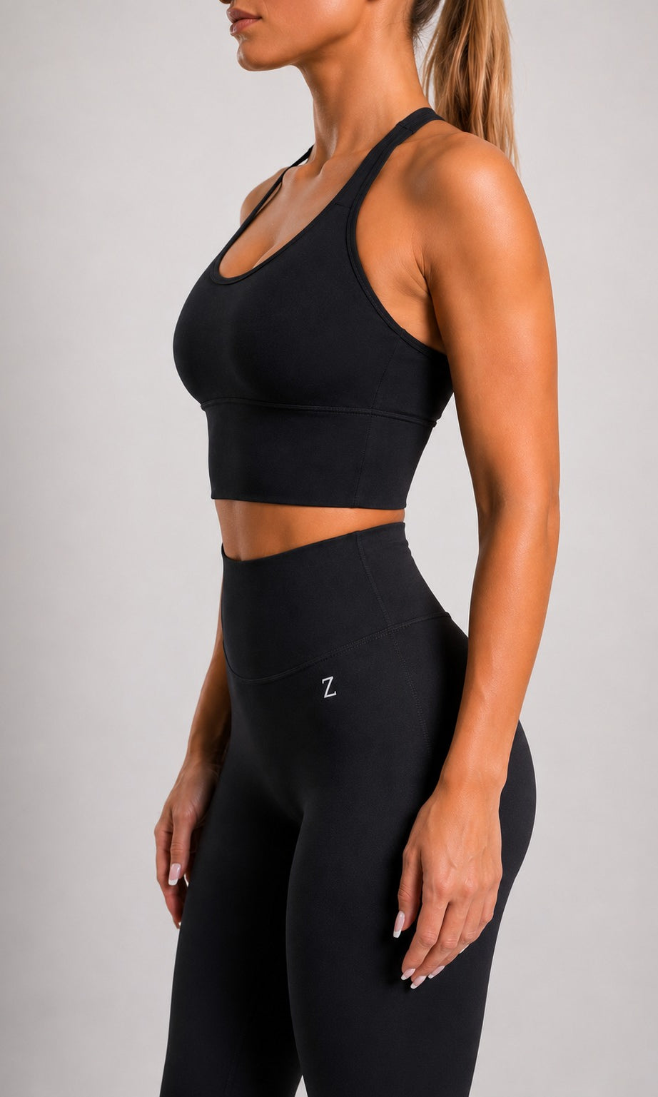 Back view of NOIR Cross Top in Black showing cross-back straps.