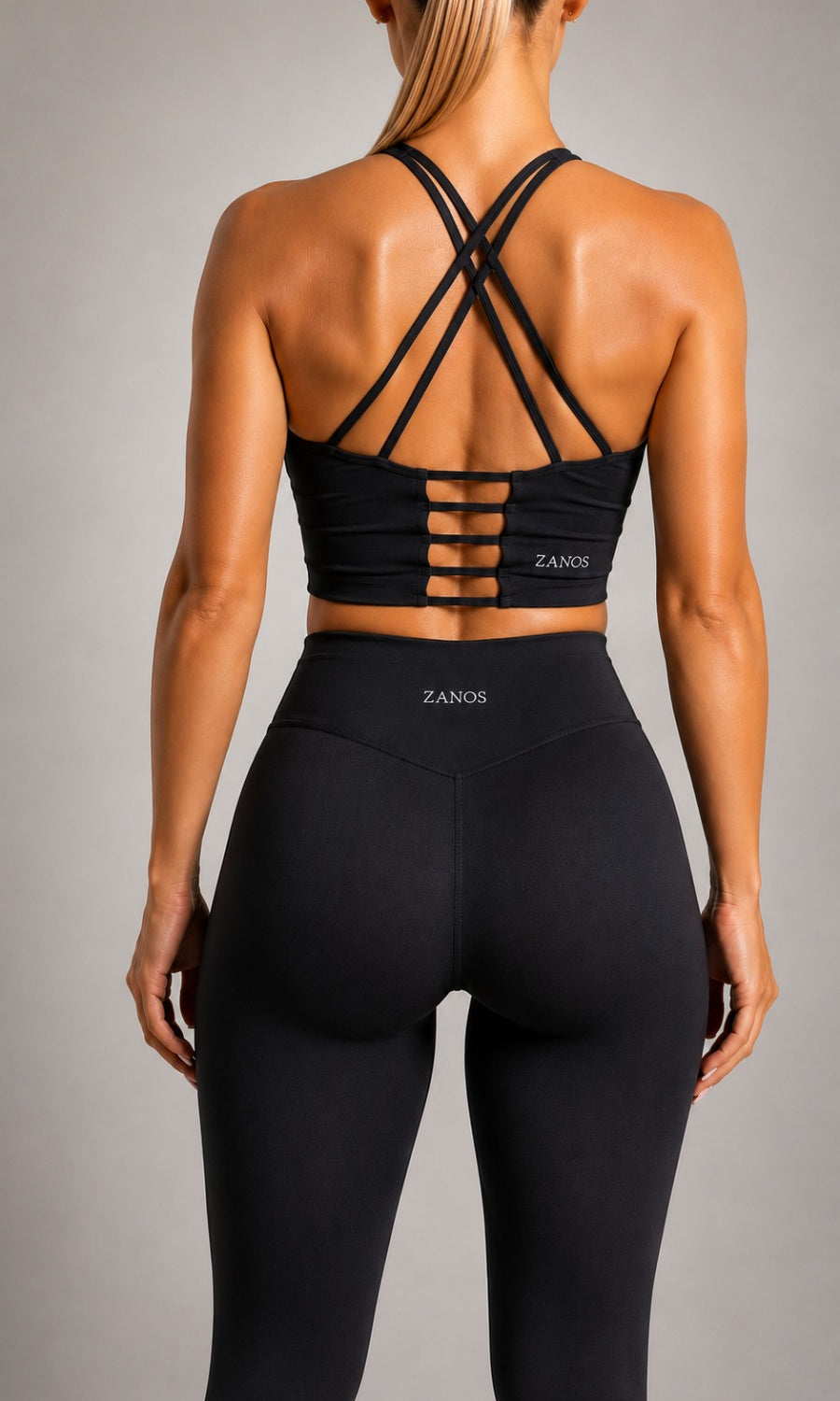 Close-up of NOIR Cross Top in Black fabric and straps.
