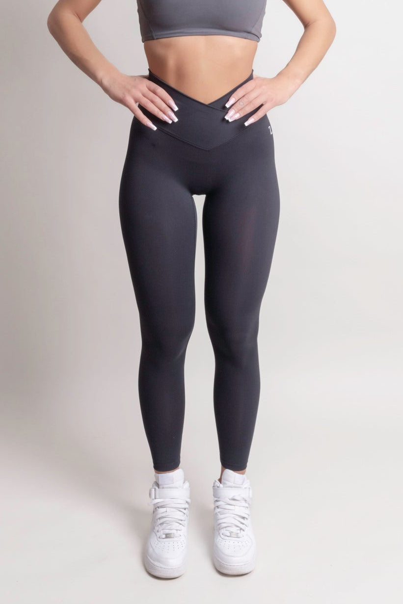 Woman wearing black NOIR Sculpt leggings by ZANOS Apparel