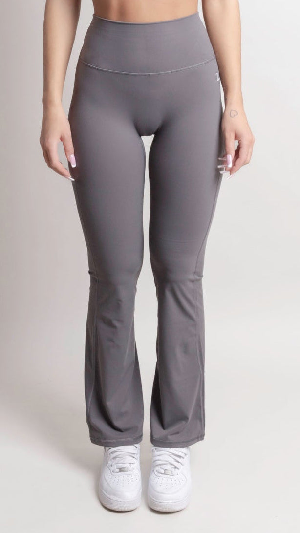 NOIR Flare Pants Grey Women showcasing a flattering high-waisted design with a flared leg silhouette.