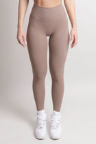 NOIR Yoga Leggings Brown Women showcasing a supportive and sculpting fit, perfect for comfort during workouts.
