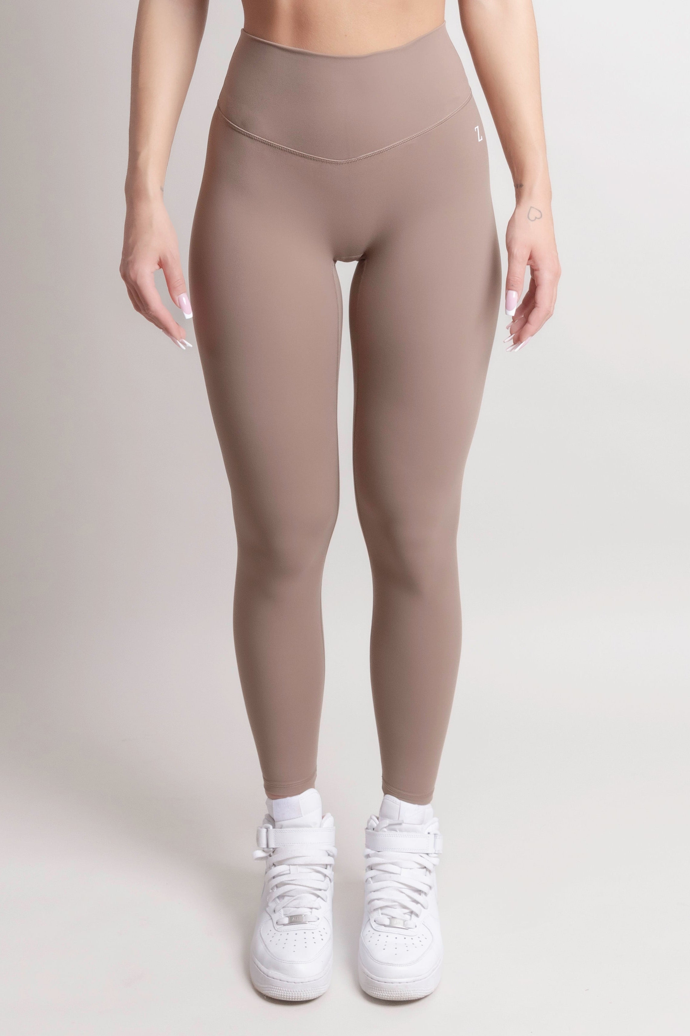 NOIR Yoga Leggings Brown Women showcasing a supportive and sculpting fit, perfect for comfort during workouts.