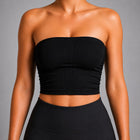 Woman wearing NOIR Bandeau Top in Black, side view.