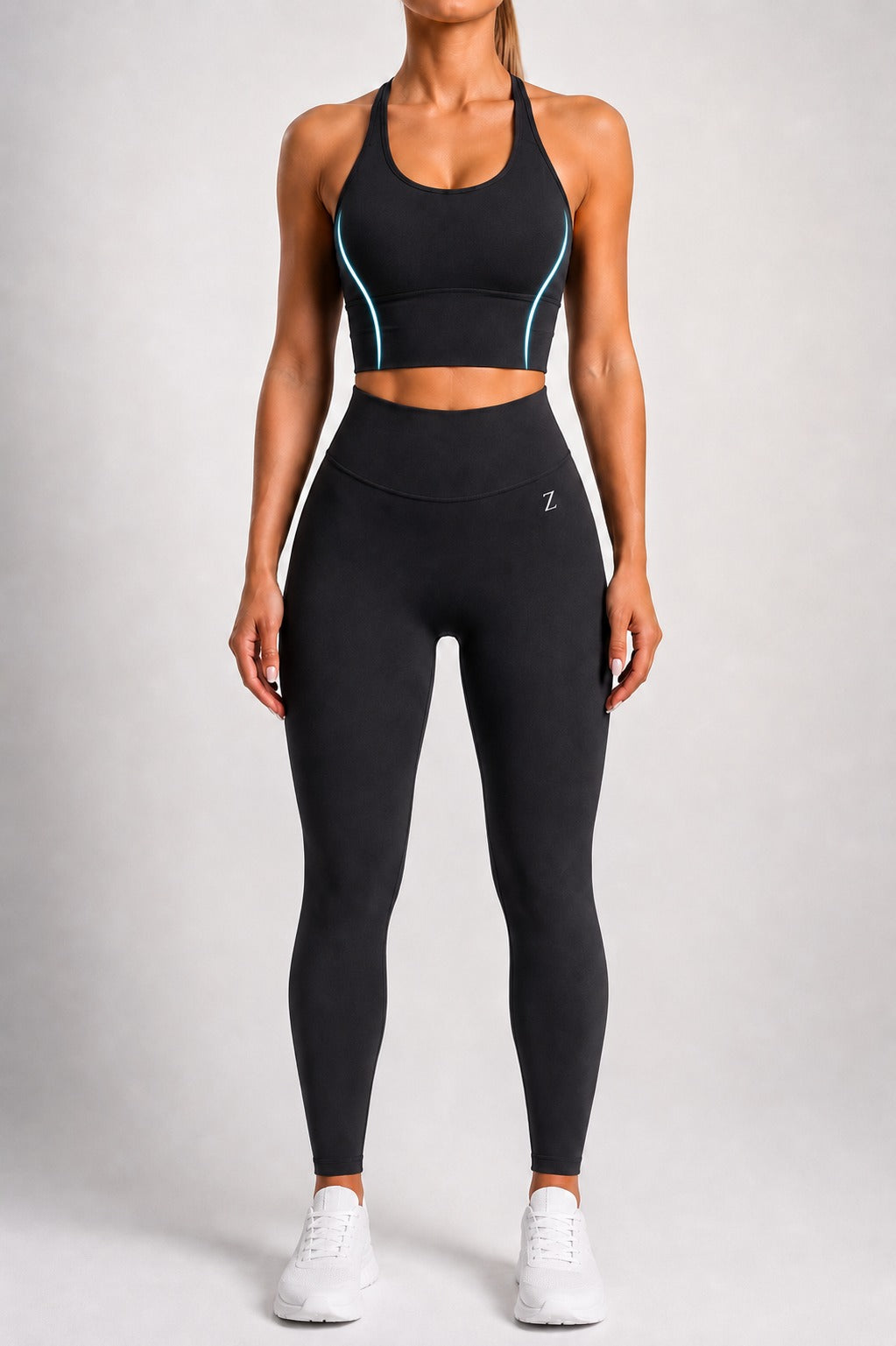 Woman wearing NOIR Cross Top in Black, front view.