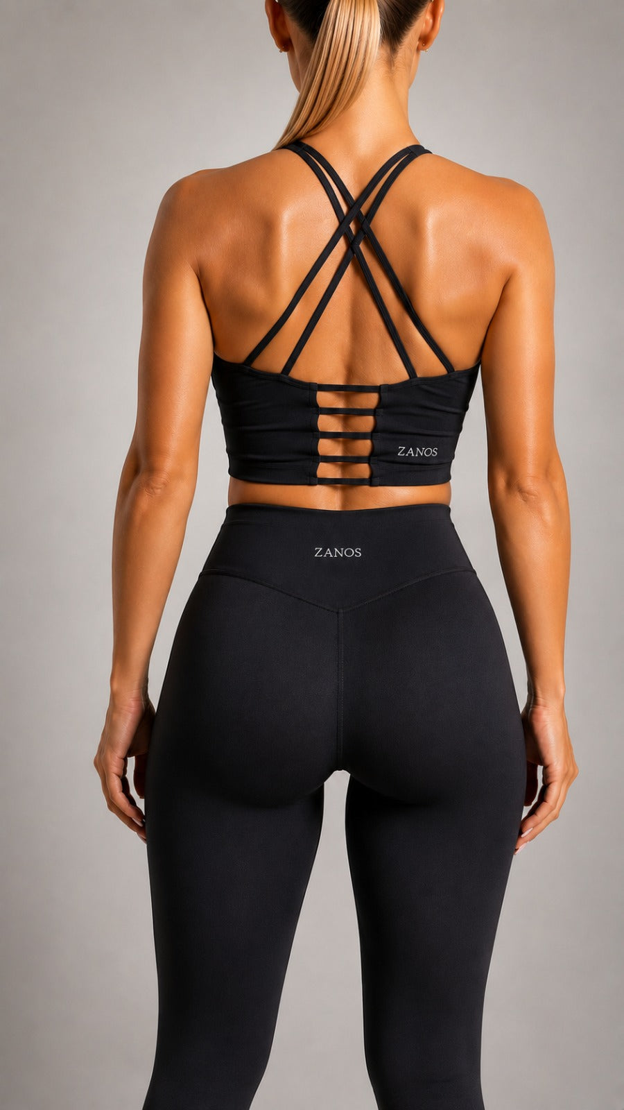 Close-up of NOIR Cross Top in Black fabric and straps.