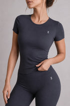 Woman wearing NOIR T-Shirt in Black, front view.