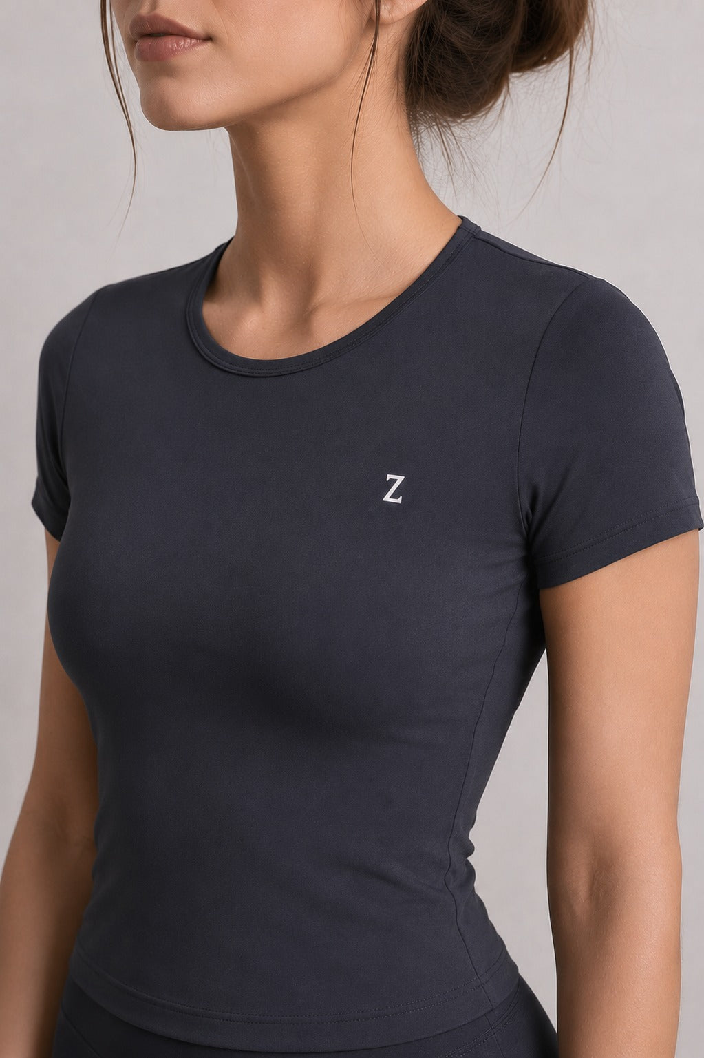 Woman wearing NOIR T-Shirt in Black paired with black leggings.